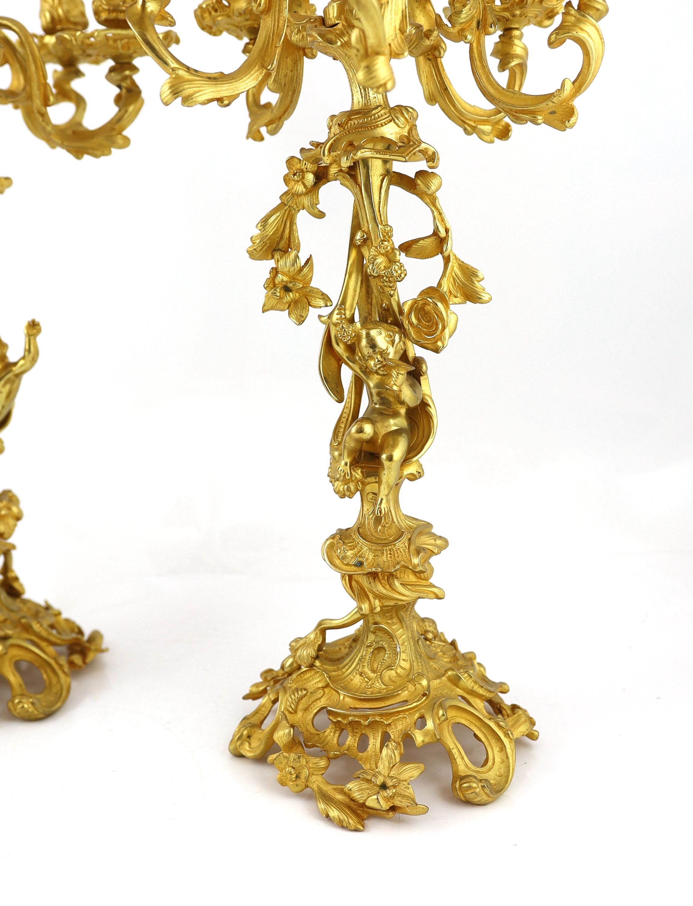 A pair of Victorian style ormolu six light candelabra 66cm high